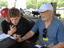 David Bern, W2LNX, shows Pierce Pollard and Weston Pollard how to operate an amateur HF radio and how to make contacts. [Photo courtesy of David Bern, W2LNX]